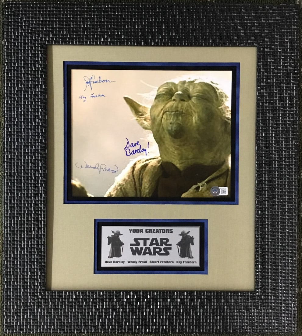 Yoda Signed Photograph Custom Framed 19" x 17" Beckett Authenticated: Yoda Signed Photograph Custom Framed 19" x 17" Beckett Authenticated This custom framed photograph features Yoda from the iconic film "Star Wars: Episode V - The Empire Strikes Back" (1983). It is a m