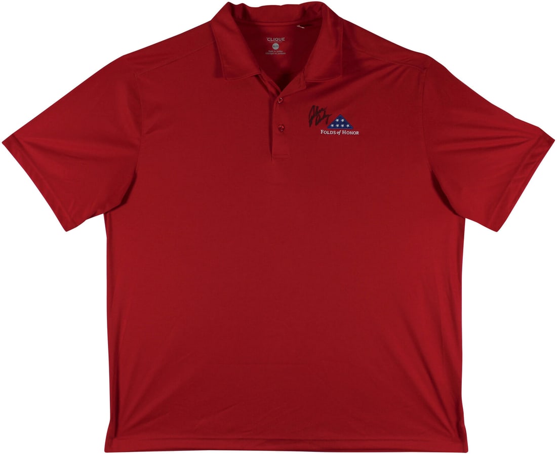 John Daly Signed Match Worn Red Folds of Honor Polo Shirt BAS Authenticated: John Daly Signed Match Worn Red Folds of Honor Polo Shirt BAS Authenticated This authentic match worn red Folds of Honor Clique polo shirt has been personally signed by professional golfer John Daly.