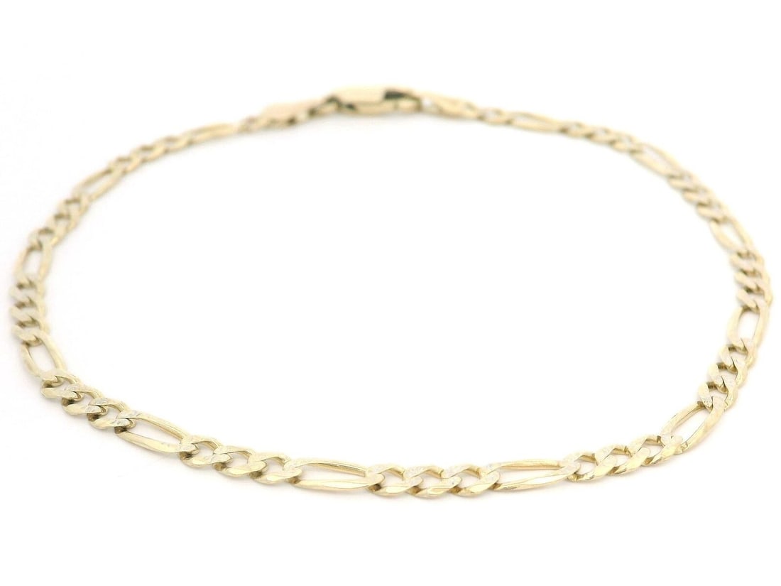 Elegant 10k Yellow Gold Diamond Cut Figaro Link Bracelet 7.5": Elegant 10k Yellow Gold Diamond Cut Figaro Link Bracelet 7.5" This elegant Solid 10k Yellow Gold Figaro Link Chain Bracelet features a classic design that showcases the diamond cut finish, adding a br