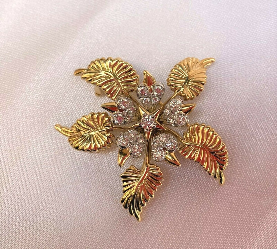 Jean Schlumberger 18K Gold Platinum Diamond Brooch Tiffany & Co Special Order: Jean Schlumberger 18K Gold Platinum Diamond Brooch Tiffany & Co Special Order This exquisite floral brooch, crafted by Jean Schlumberger for Tiffany & Co., showcases a stunning combination of 18K yell
