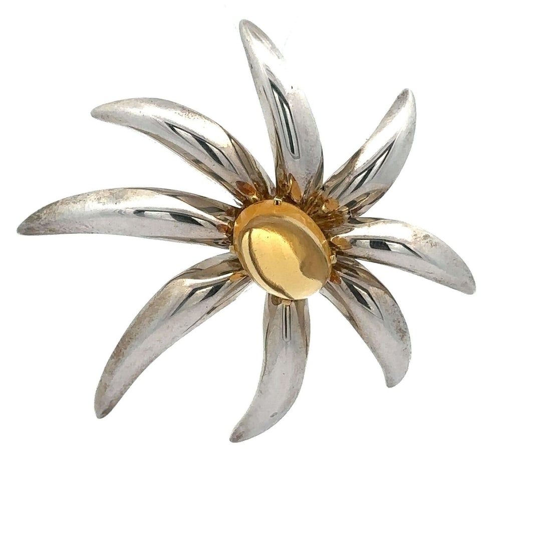 Tiffany & Co. 1995 Fireworks Citrine 18k Gold Sterling Silver Brooch: Tiffany & Co. 1995 Fireworks Citrine 18k Gold Sterling Silver Brooch This stunning brooch from Tiffany & Co. features a captivating cabochon cut citrine stone in a vibrant orange hue, elegantly set in