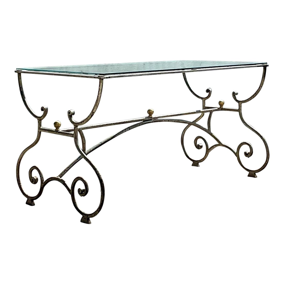 Vintage Regency Console Table with Scroll Design and Glass Top: Vintage Regency Console Table with Scroll Design and Glass Top This stunning vintage Regency console table features an elegant scroll design with a beautiful silver patinated finish. A glass top seaml