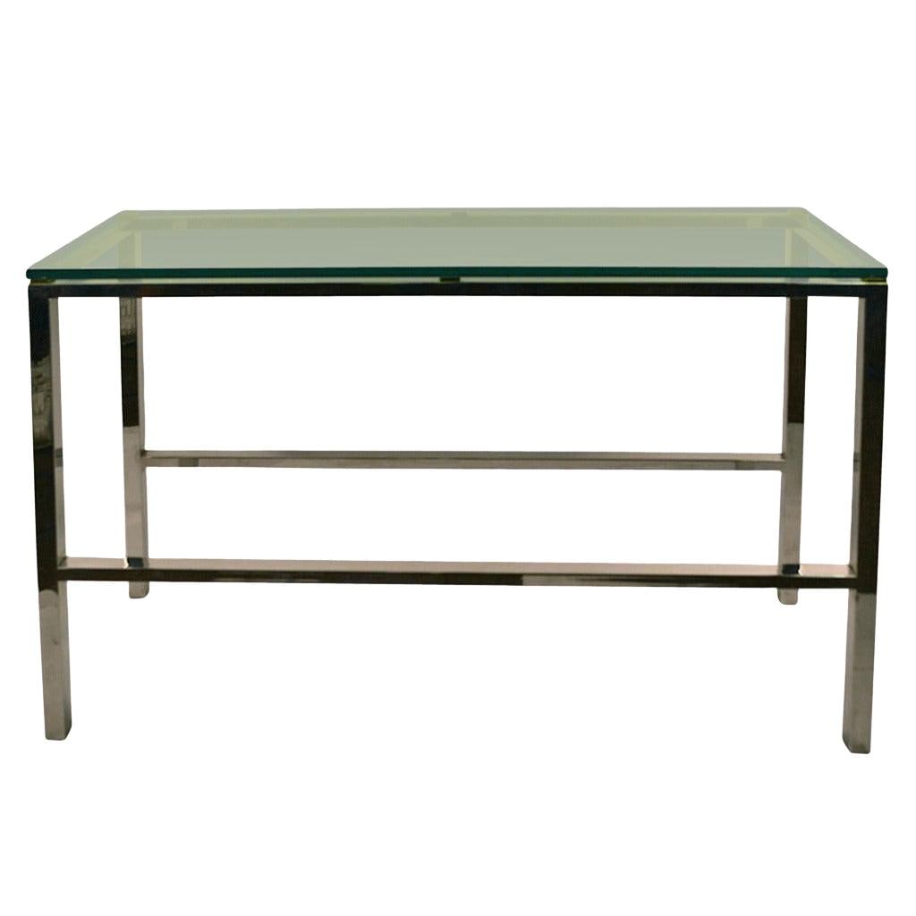 Elegant Chrome and Brass Console Table 54 x 18 x 32.25: Elegant Chrome and Brass Console Table 54 x 18 x 32.25 This elegant console table features a fine quality metal construction with a chrome base and frame, complemented by square brass tabs that provid