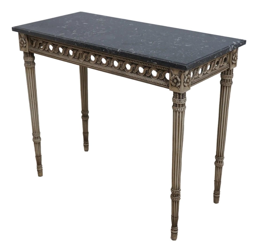 Italian Louis XVI Style Carved Console Table with Black Marble Top: Italian Louis XVI Style Carved Console Table with Black Marble Top This exquisite French Louis XVI style console table showcases fine carved details and high-quality construction. Crafted in Italy app