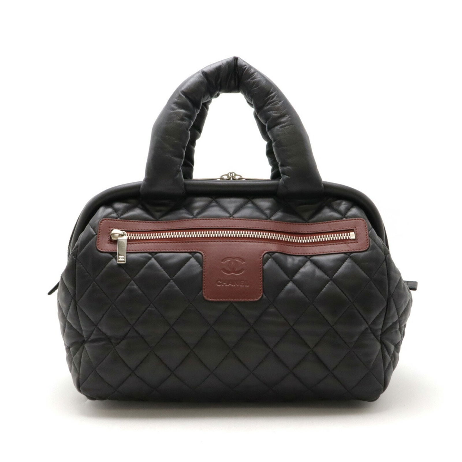 Chanel Cococoon Quilted Boston Tote Handbag Black Bordeaux Leather: Chanel Cococoon Quilted Boston Tote Handbag Black Bordeaux Leather This CHANEL Cococoon Quilted Handbag is a stylish and versatile accessory, perfect for any woman on the go. Crafted from high-quality