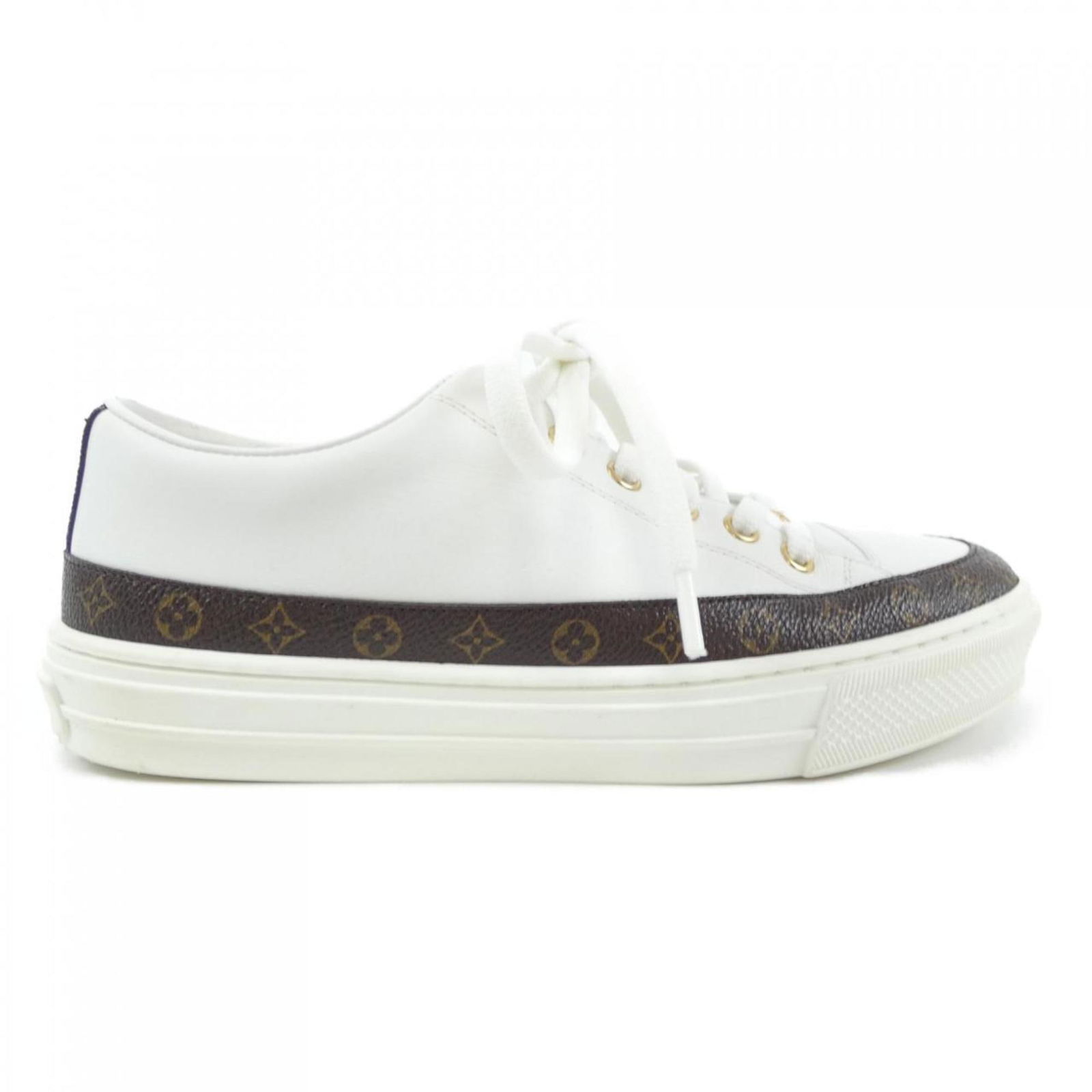 Louis Vuitton Brown White Calf Leather Sneakers: Louis Vuitton Brown White Calf Leather Sneakers Elevate your sneaker game with these stylish Louis Vuitton sneakers, expertly crafted from high-quality calf leather. The classic brown and white color
