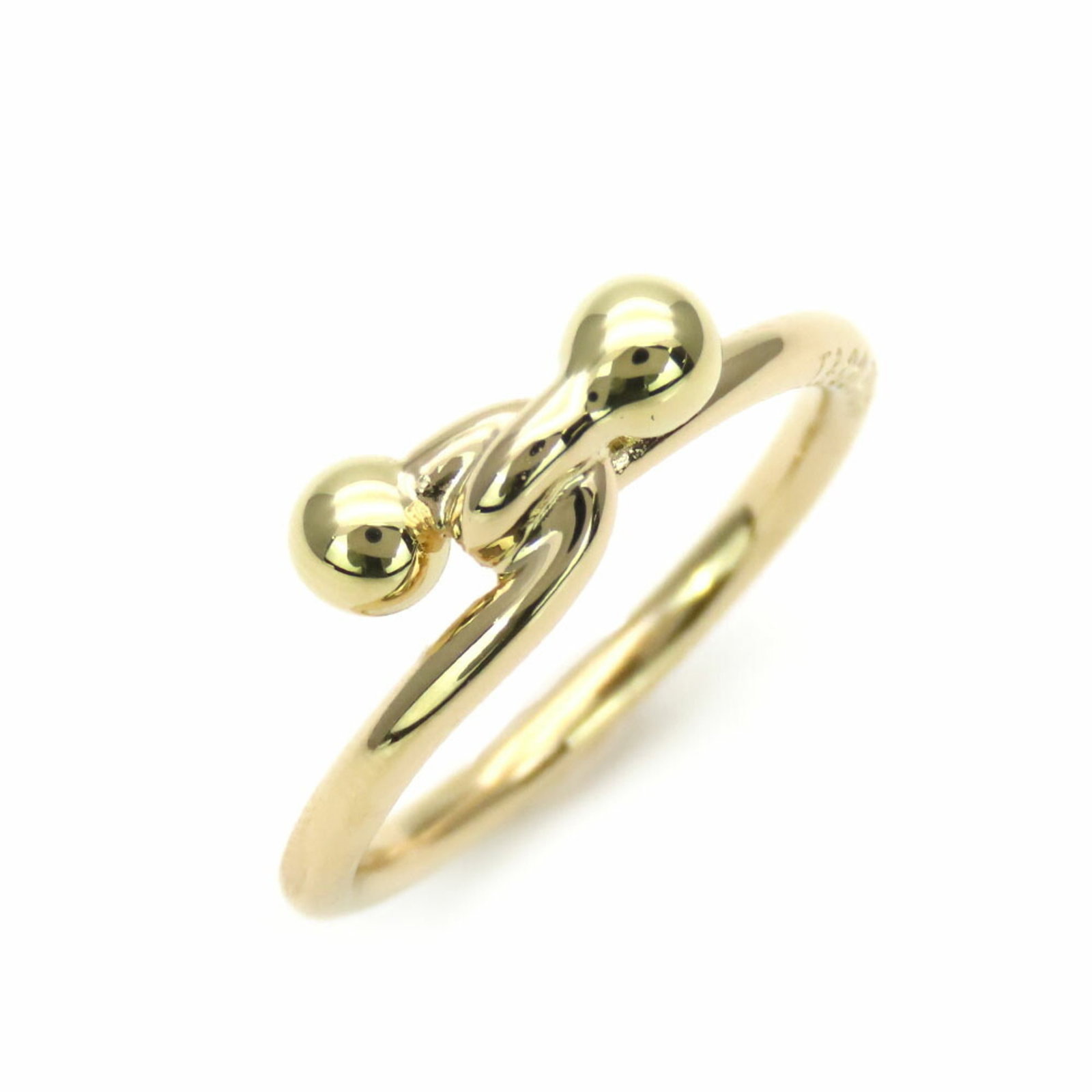 Tiffany & Co. Love Knot Band Ring 18K Yellow Gold 3.07g Size 10.5: Tiffany & Co. Love Knot Band Ring 18K Yellow Gold 3.07g Size 10.5 This elegant Tiffany & Co. Love Knot ring is crafted in 18K yellow gold, showcasing a timeless design perfect for any occasion. With a