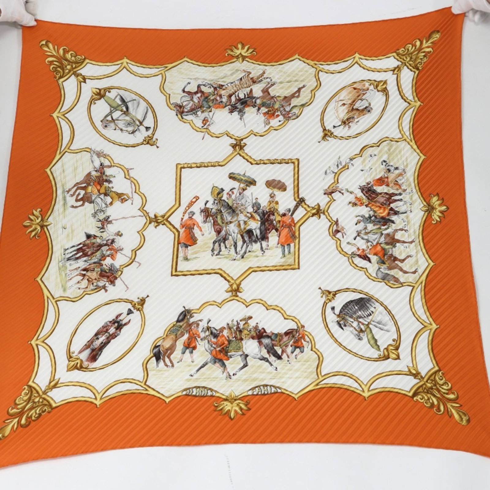 Hermes Silk Scarf Mughal Horses Design Orange 86cm x 88cm: Hermes Silk Scarf Mughal Horses Design Orange 86cm x 88cm This exquisite Hermes scarf features a stunning Mughal Horses design, showcasing intricate motifs in vibrant orange silk. Ideal for both men a