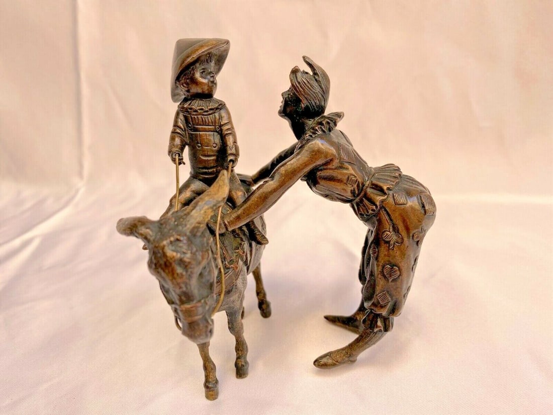 1900 French Bronze Statue Boy on Donkey with Clown 4.9" Tall: 1900 French Bronze Statue Boy on Donkey with Clown 4.9" Tall This magnificent original 1900 French bronze statue shows a boy riding on a donkey with a clown. It measures 4" front, 4" wide and 4.9" tal