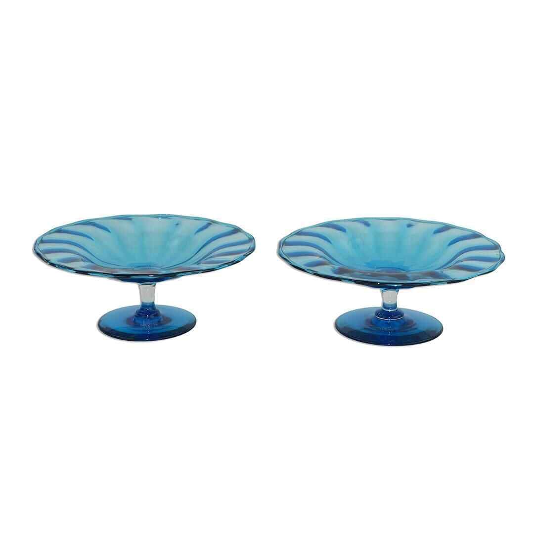 Steuben Celeste Blue Art Glass Compote Set of 2 7x3 Inches: Steuben Celeste Blue Art Glass Compote Set of 2 7x3 Inches This exquisite set of two Steuben Celeste Blue Glass Compotes showcases the elegance of Art Glass design. Crafted in a beautiful shade of blu