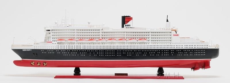 Queen Mary II Ship Model - Nautical Style: Queen Mary II Ship Model - Nautical Style This exquisite hand-built model of the Queen Mary II cruise ship is a must-have for nautical collectors. Crafted with meticulous plank-on-frame construction,