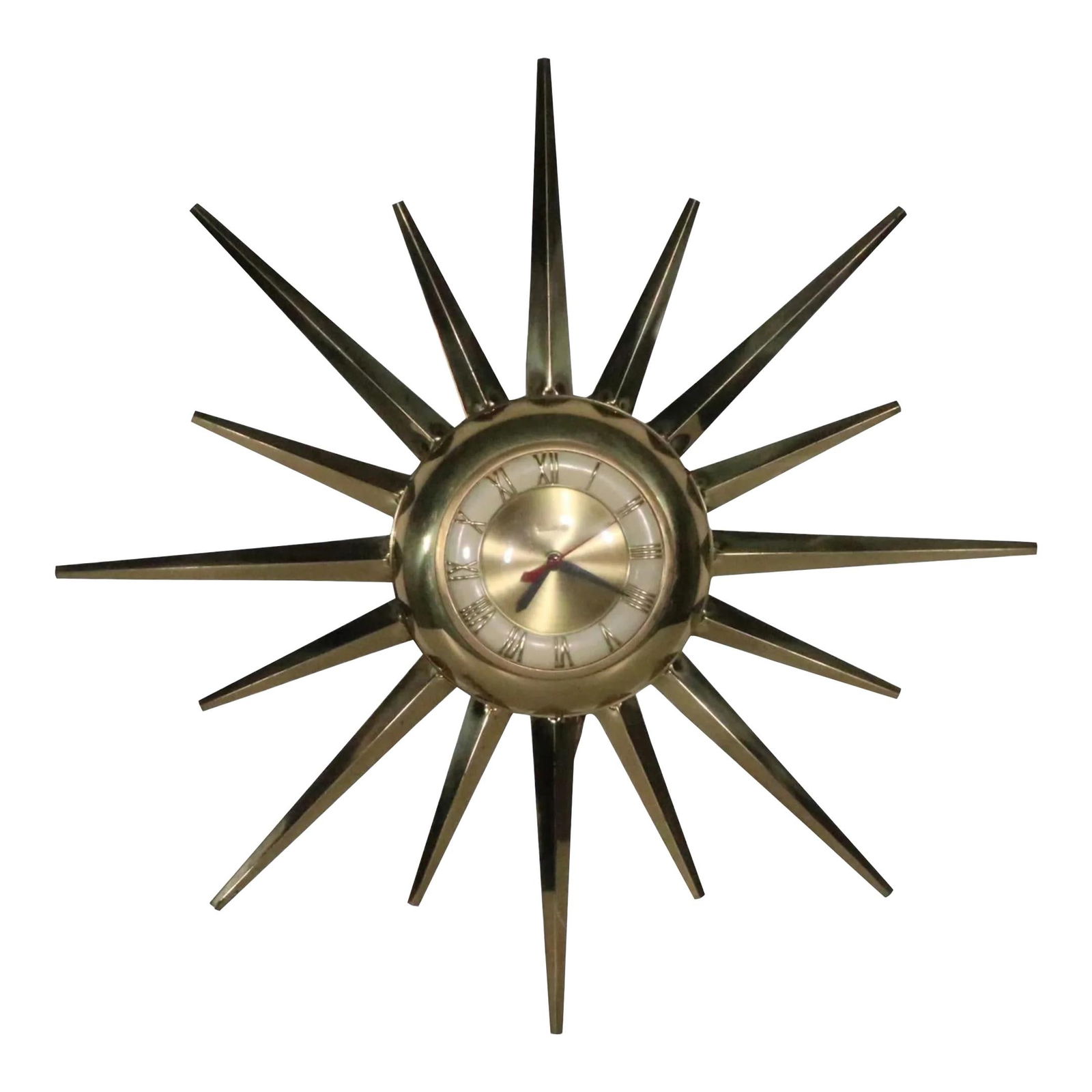 United Brass Mid Century Sunburst Wall Clock 24" Diameter: United Brass Mid Century Sunburst Wall Clock 24" Diameter Brass Mid Century Sunburst form wall clock, by United, circa 1950/1960's. The clock features a face with Roman numerals, and pointy triangular