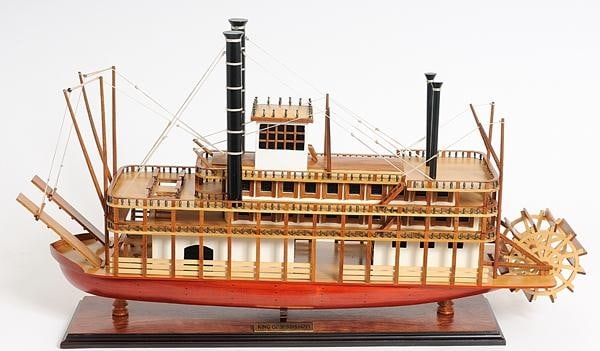 Handcrafted Mississippi Steamship Model: Handcrafted Mississippi Steamship Model This exquisite handcrafted model of the King Mississippi steamship is a stunning display piece that captures the elegance of Victorian design. Featuring fully-a