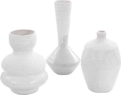 John-Richard Set of 3 Greek White Glass Vases: John-Richard Set of 3 Greek White Glass Vases Discover this exquisite set of three Greek-inspired white glass vases that elevate any decor with their contemporary style. Each vase features a unique sh