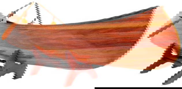 Hand-Crafted Indian Girl Canoe Model: Hand-Crafted Indian Girl Canoe Model This stunning hand-crafted replica of the 1902 Indian Girl Canoe is a perfect addition for collectors and enthusiasts alike. Featuring a highly detailed design, th