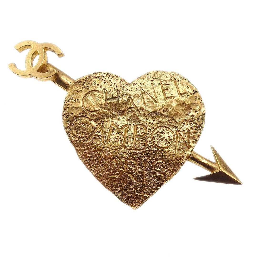 Chanel 93A Gold-Plated Bow and Arrow Heart Brooch 4in: Chanel 93A Gold-Plated Bow and Arrow Heart Brooch 4in Introducing a stunning Chanel Bow and Arrow Heart Brooch, a remarkable accessory that embodies elegance and charm. Crafted from gold-plated materi