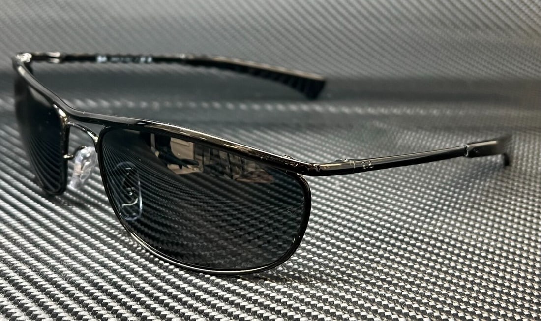Ray-Ban Olympian I Deluxe RB3119M 002 R5 Black Oval Sunglasses: Ray-Ban Olympian I Deluxe RB3119M 002 R5 Black Oval Sunglasses Introducing the RAY BAN RB3119M 002 R5 Black Oval Unisex Sunglasses, featuring a stylish and versatile design. These sunglasses have a so