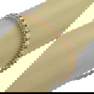 Vintage 14k Yellow Gold Diamond Ruby Tennis Bracelet: Vintage 14k Yellow Gold Diamond Ruby Tennis Bracelet Introducing a stunning Diamond & Ruby Tennis Bracelet crafted from lustrous 14k Yellow Gold. This vintage piece showcases a sophisticated arrangeme
