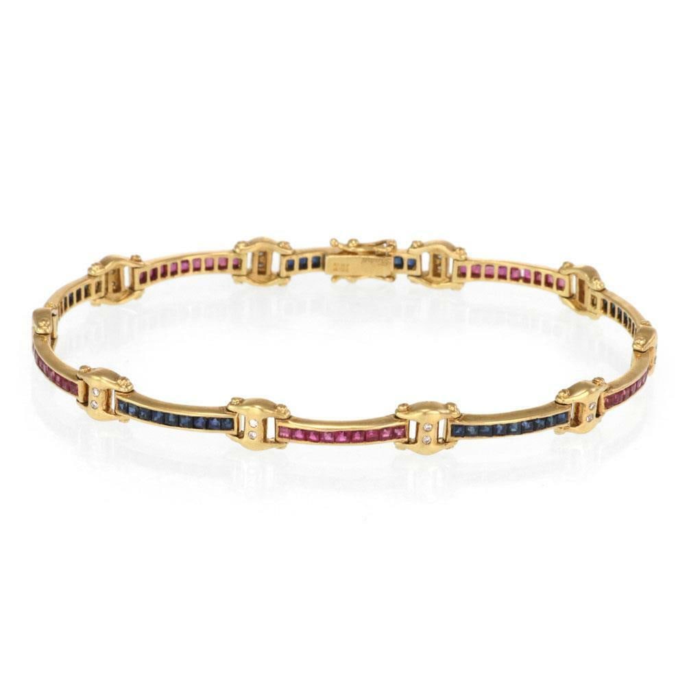 Elegant 18k Yellow Gold 4.20ct Diamond Sapphire Ruby Bracelet: Elegant 18k Yellow Gold 4.20ct Diamond Sapphire Ruby Bracelet This exquisite bracelet is designed in 18k yellow gold and features elegantly crafted long slim curved bar links that alternate with strik