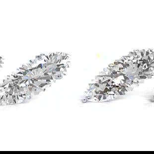 14K White Gold 7.24 Ct Diamond Stud Earrings K-L VS1-VS2: 14K White Gold 7.24 Ct Diamond Stud Earrings K-L VS1-VS2 These stunning 14K White Gold Diamond Stud Earrings feature a total diamond weight of 7.24 ct. The earrings are beautifully set with two brilli