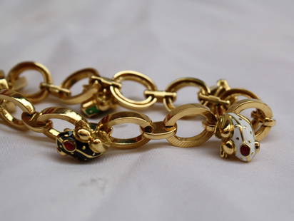 David Webb 18K Yellow Gold Enamel Frog Chain Bracelet: David Webb 18K Yellow Gold Enamel Frog Chain Bracelet This exquisite David Webb bracelet showcases a stunning design featuring vibrant enamel set in luxurious 18k yellow gold. The bracelet's chain sty