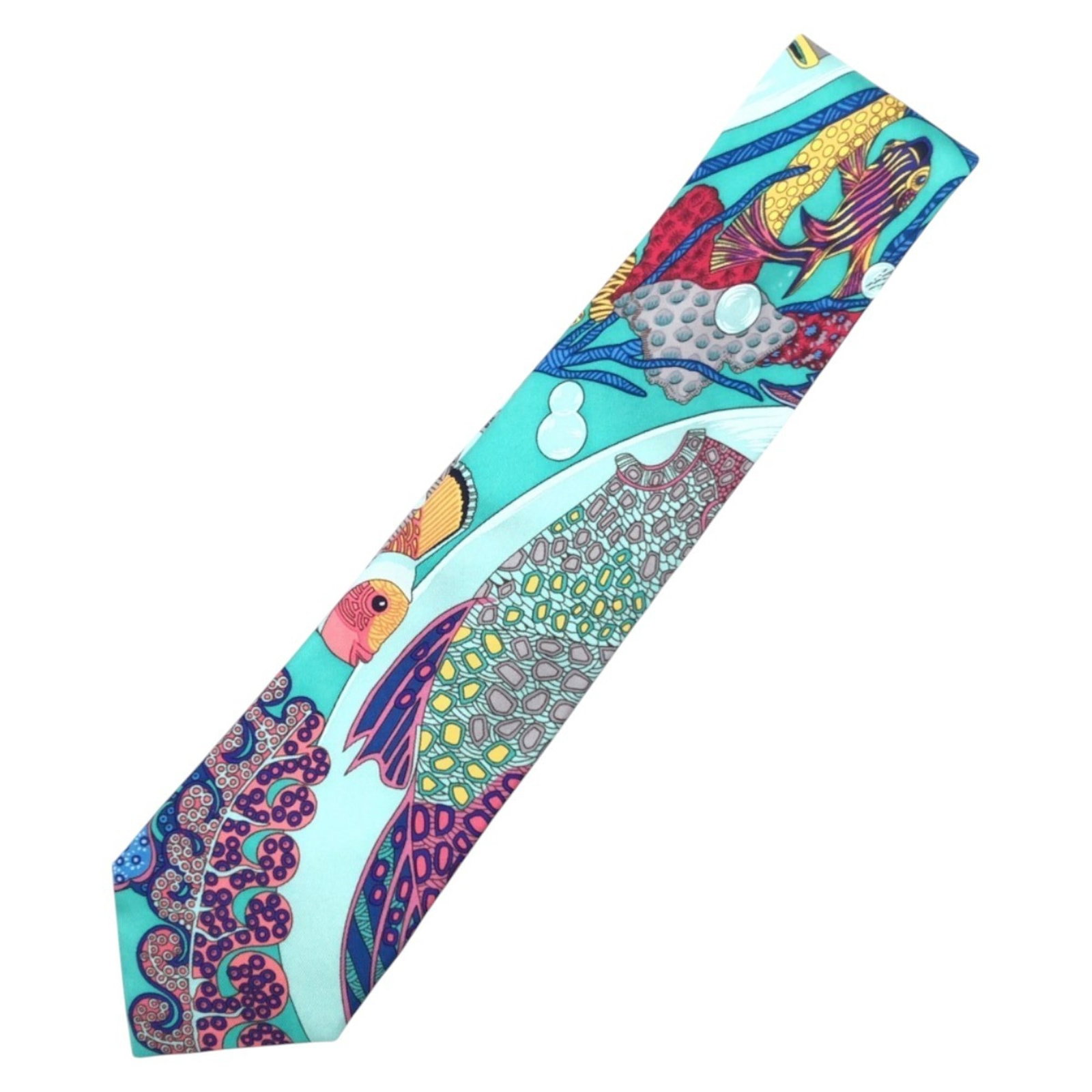 Hermes Tropical Blue Turquoise Silk Cravat Tie Unisex: Hermes Tropical Blue Turquoise Silk Cravat Tie Unisex This exquisite Hermes silk cravat features a vibrant tropical pattern in shades of blue and turquoise, making it a stylish accessory for any occas