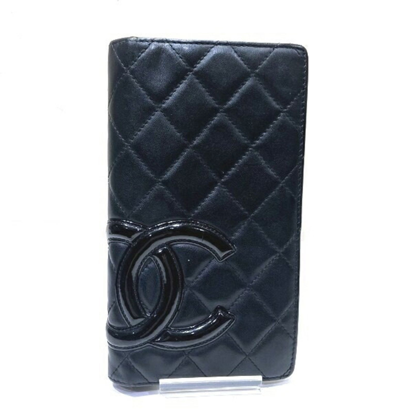 Chanel Cambon Line Black Bi-fold Wallet for Women: Chanel Cambon Line Black Bi-fold Wallet for Women This Chanel Cambon Line Coco Mark Bi-fold Wallet is a stylish and practical accessory designed for women. Crafted from high-quality Cambon ligne mater