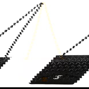 Chanel Black Lambskin Jumbo Double Flap Bag Gold Tone Hardware: Chanel Black Lambskin Jumbo Double Flap Bag Gold Tone Hardware This exquisite Chanel Jumbo Double Flap bag is crafted from luxurious black lambskin and features elegant gold tone hardware. Designed fo