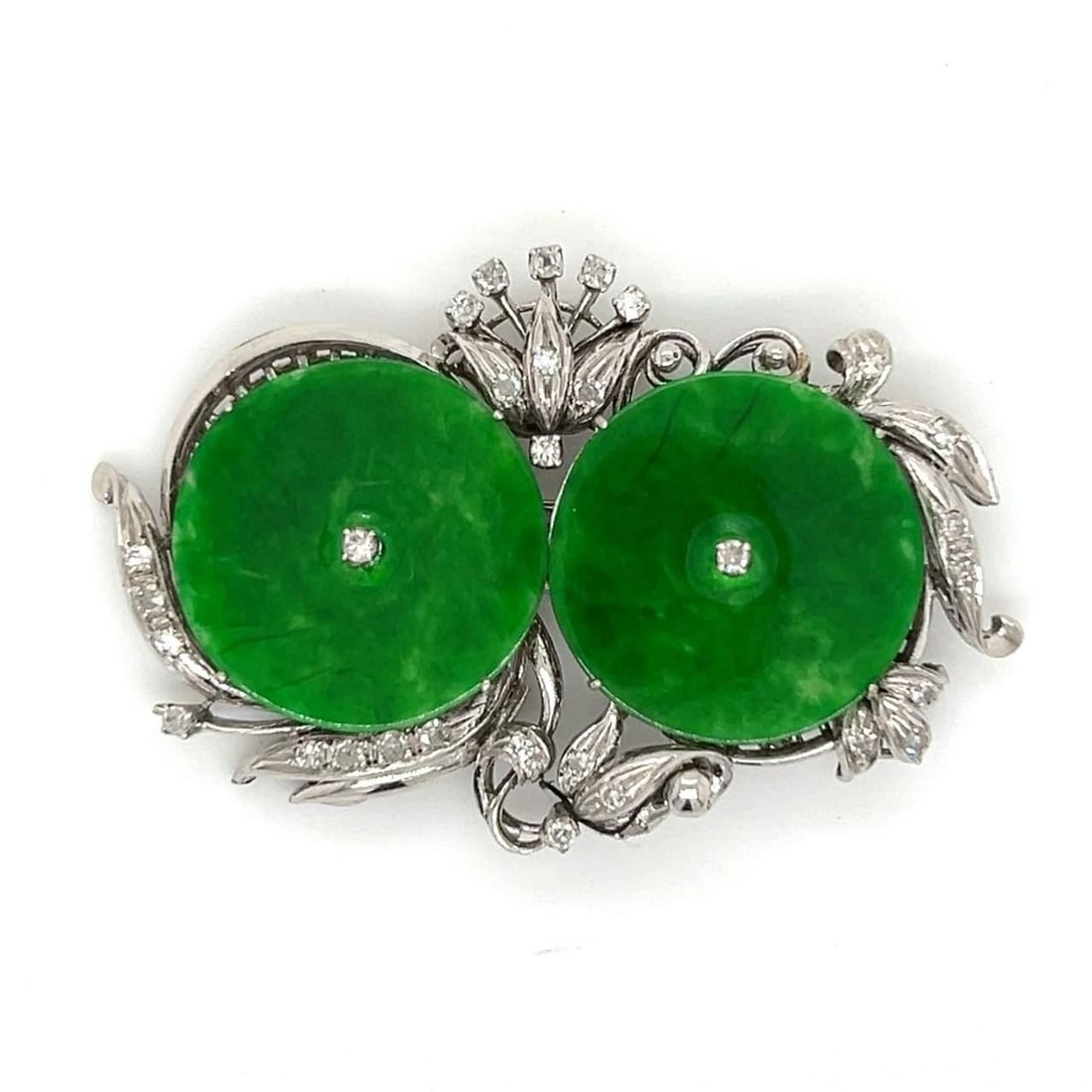 Vintage 1950s 14K White Gold Jade Diamond Brooch 2 inches: Vintage 1950s 14K White Gold Jade Diamond Brooch 2 inches This exquisite vintage brooch from the 1950s showcases a stunning combination of 14K white gold, jade, and diamonds. Weighing 13.8 grams, it f