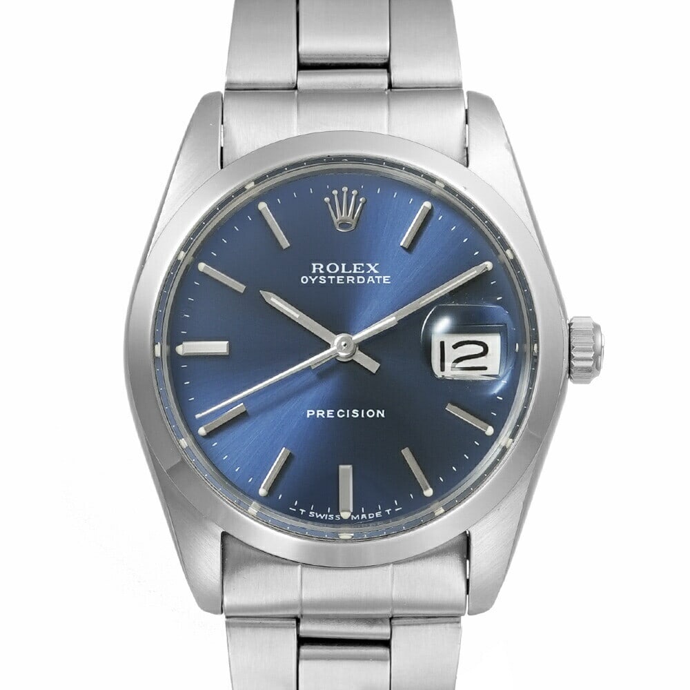 ROLEX Oysterdate 6694 Men's Vintage Watch Blue Dial 34mm Stainless Steel Circa 1972: ROLEX Oysterdate 6694 Men's Vintage Watch Blue Dial 34mm Stainless Steel Circa 1972 This ROLEX Oysterdate Men's Watch is a vintage wristwatch from around 1972, featuring a stunning blue dial and a han