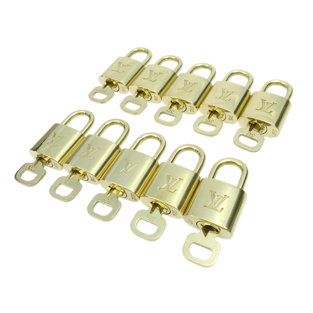 Louis Vuitton Gold Padlock & Key Accessories Charm Set 10 Pieces: Louis Vuitton Gold Padlock & Key Accessories Charm Set 10 Pieces Enhance your luxury collection with this stunning Louis Vuitton Padlock & Key Bag Accessories Charm 10 Piece Set. Featuring a sophistic