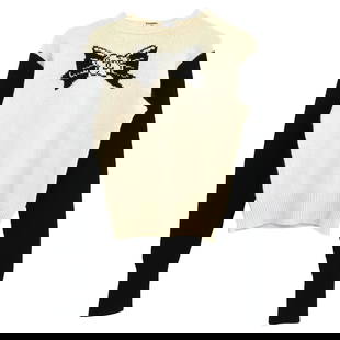 Chanel Off-White Cashmere Sweater Long Sleeve #42: Chanel Off-White Cashmere Sweater Long Sleeve #42 This exquisite Chanel sweater is crafted from 100% cashmere, providing a luxurious feel and warmth. The sweater features a stylish off-white and black