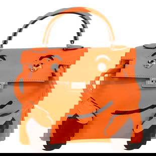 Hermes Kelly Doll Orange Leather Top Handle Handbag: Hermes Kelly Doll Orange Leather Top Handle Handbag This exquisite Hermes Kelly Doll mascot handbag features a vibrant orange exterior crafted from high-quality leather. Designed in a small size, it i