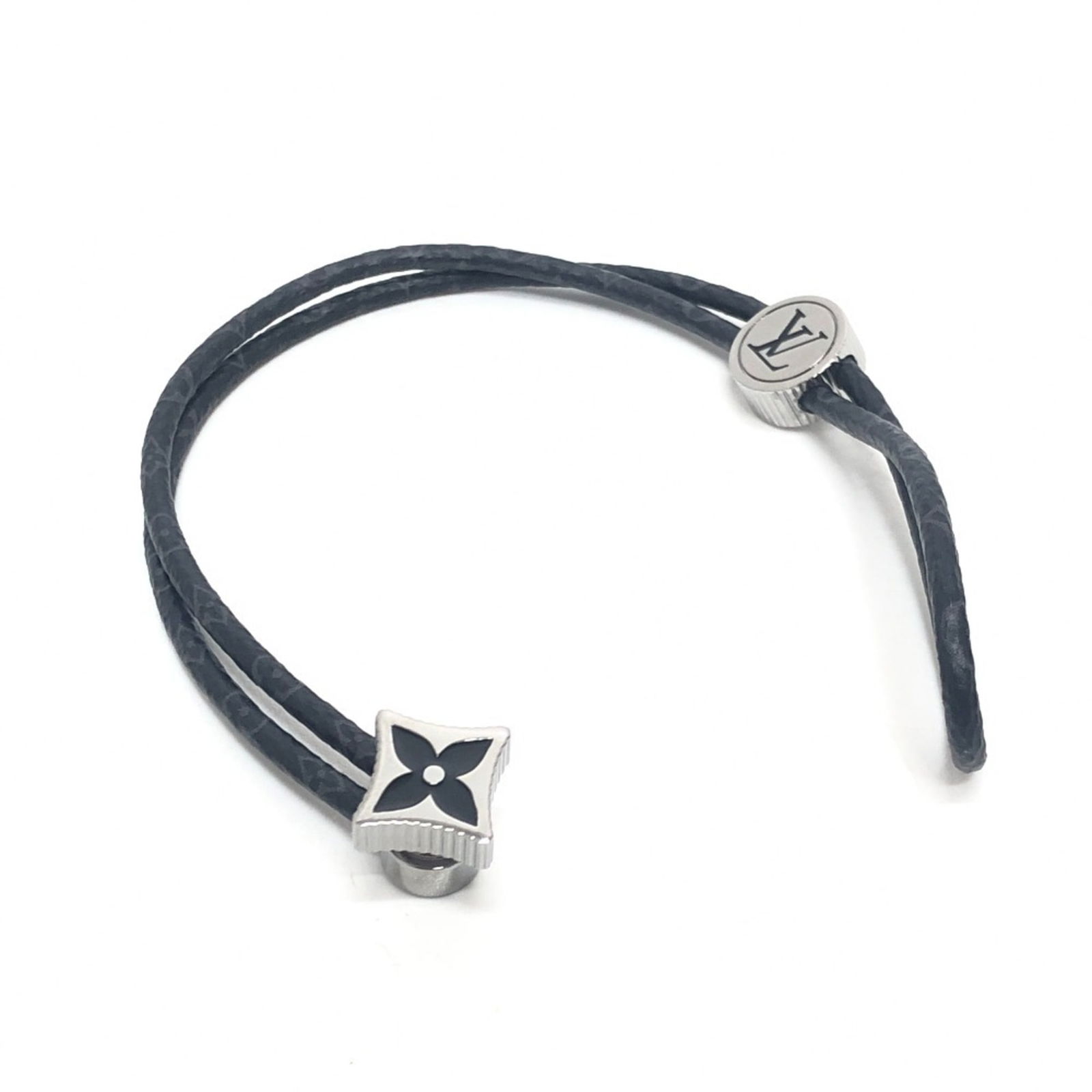 Louis Vuitton Catch It Bracelet Monogram Eclipse Black Charm Accessory: Louis Vuitton Catch It Bracelet Monogram Eclipse Black Charm Accessory Elevate your accessory game with the LOUIS VUITTON Catch It Bracelet, expertly crafted from Monogram Eclipse Canvas. This stylish