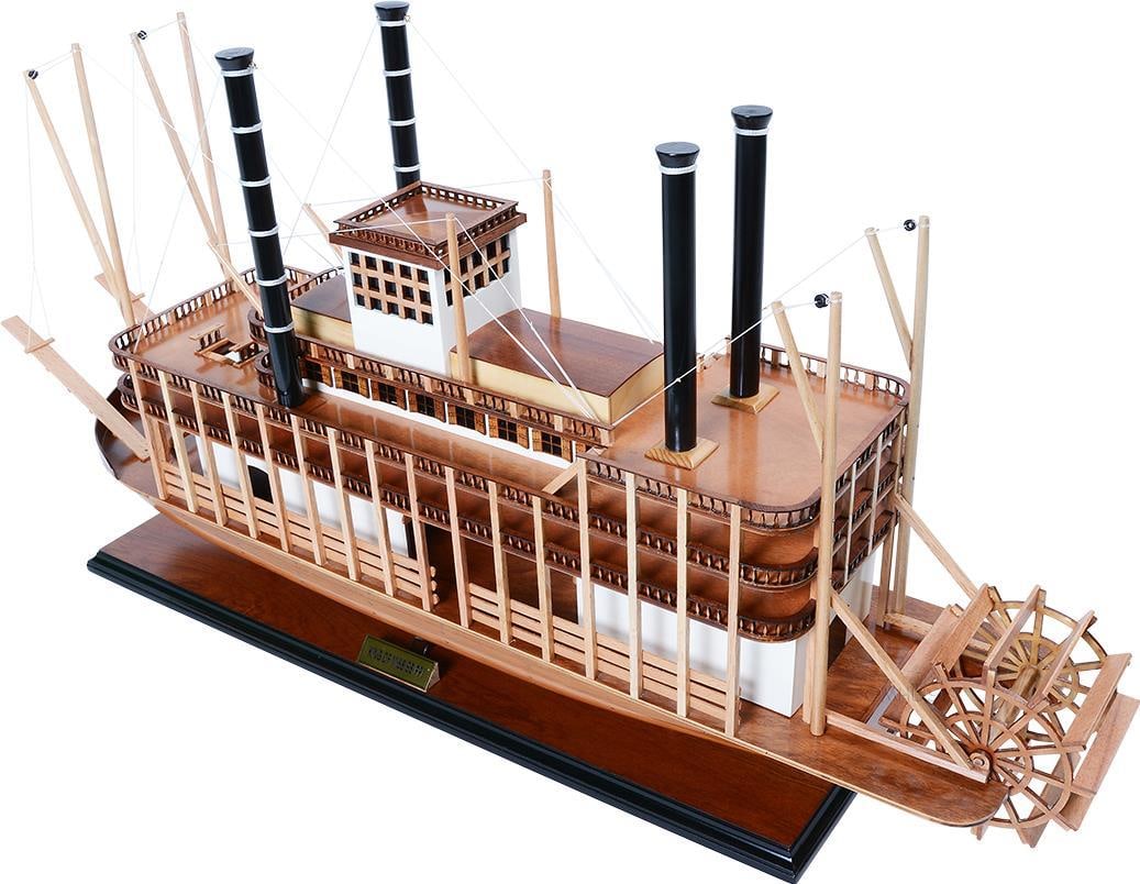 Handcrafted Mississippi Steamship Model: Handcrafted Mississippi Steamship Model This exquisite handcrafted model of the King Mississippi steamship is a stunning display piece that captures the elegance of Victorian design. Featuring fully-a