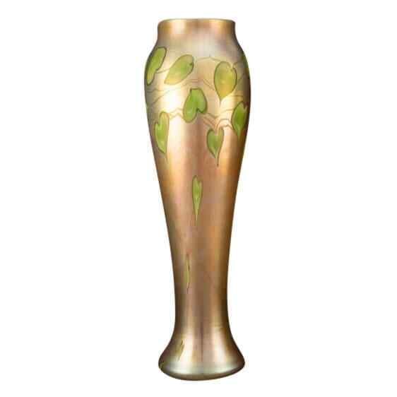 Rare Tiffany Studios 18 Inch Favrile Glass Leaf Vase Circa 1913: Rare Tiffany Studios 18 Inch Favrile Glass Leaf Vase Circa 1913 This rare monumental table vase, crafted by Tiffany Studios, showcases exquisite Favrile glass with a beautiful leaf and vine design. Ma