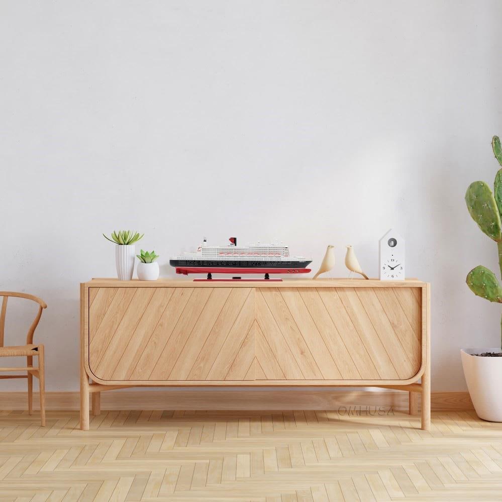 Queen Mary II Ship Model - Nautical Style: Queen Mary II Ship Model - Nautical Style This exquisite hand-built model of the Queen Mary II cruise ship is a must-have for nautical collectors. Crafted with meticulous plank-on-frame construction,