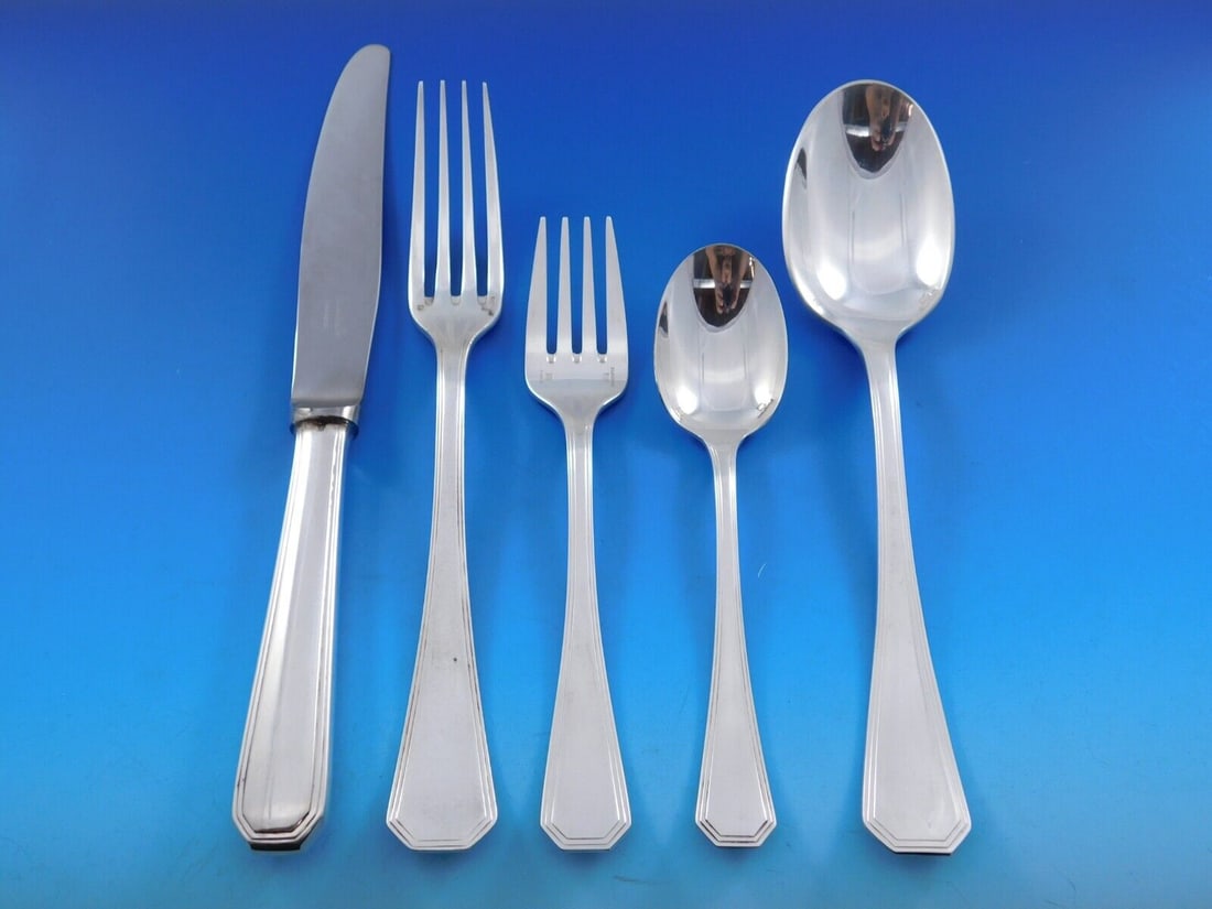 Christofle America Art Deco Silverplate Flatware Set for 12 with Storage Chest 60 Pieces: Christofle America Art Deco Silverplate Flatware Set for 12 with Storage Chest 60 Pieces Elevate your dining experience with the America silverplate flatware service by Christofle. This exquisite 60-p