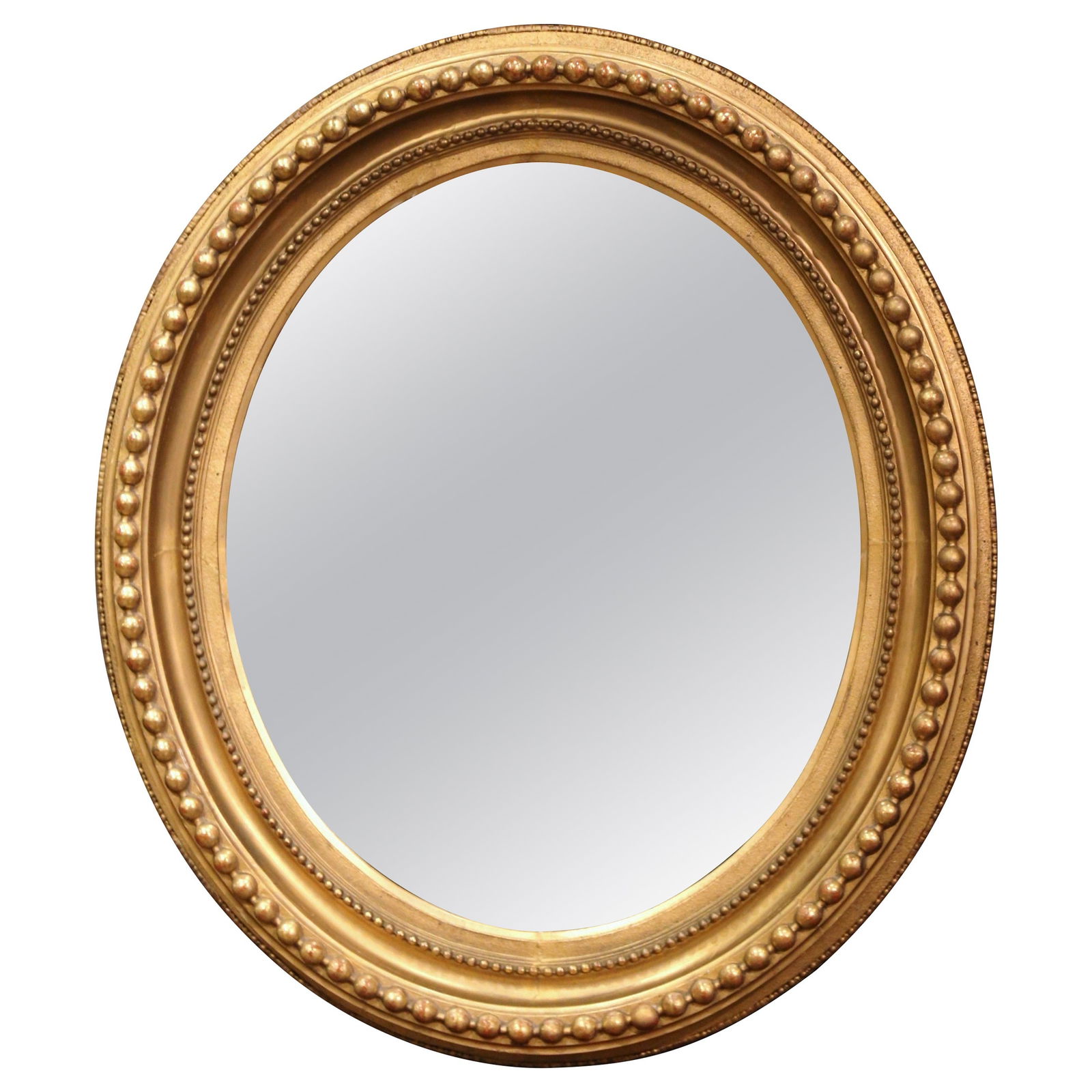 Antique 19th Century French Napoleon III Giltwood Oval Mirror 37.5" H: Antique 19th Century French Napoleon III Giltwood Oval Mirror 37.5" H This exquisite 19th Century French Napoleon III wall mirror features a beautifully hand-carved giltwood oval frame, showcasing int