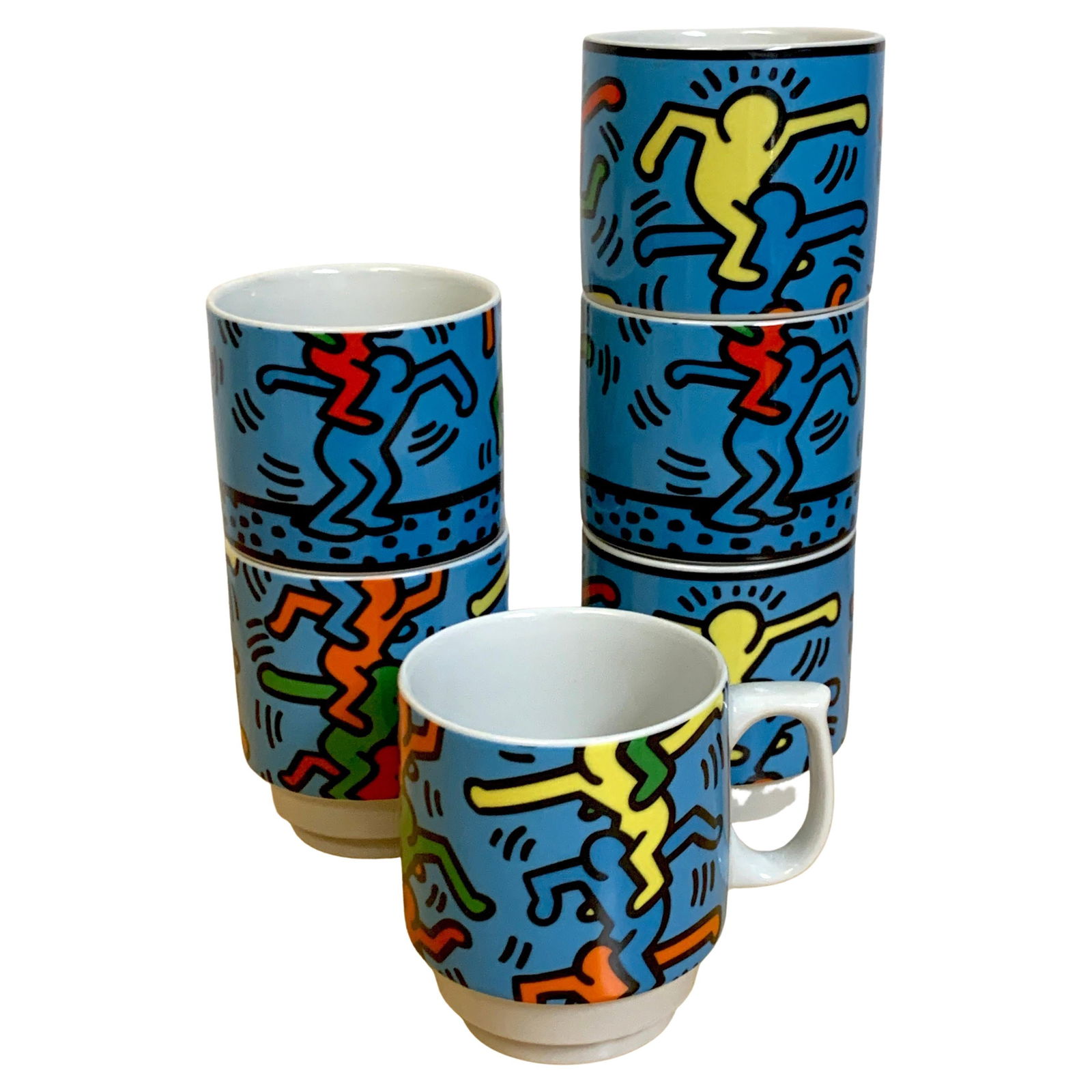 Set of 6 Keith Haring Porcelain Mugs Stacking Men Konitz Germany 1990s: Set of 6 Keith Haring Porcelain Mugs Stacking Men Konitz Germany 1990s This set of six mugs features the iconic designs of Keith Haring, known for their vibrant and playful motifs. Each mug showcases