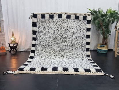 Authentic Handmade Moroccan Berber Wool Rug 3.28 x 5 Feet: Authentic Handmade Moroccan Berber Wool Rug 3.28 x 5 Feet Discover the charm of this authentic soft grey handmade Moroccan Berber wool rug. Skillfully handwoven in the Atlas Mountains by local Berber