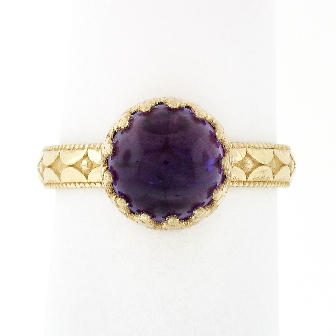 14K Yellow Gold 2.15ctw Round Cabochon Amethyst Solitaire Ring: 14K Yellow Gold 2.15ctw Round Cabochon Amethyst Solitaire Ring This exquisite ring features a stunning 2.15ctw round cabochon amethyst set in luxurious 14K yellow gold. The vibrant purple hue of the n