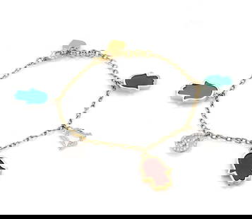 18k Yellow Gold Charm Bracelet with Diamonds and Gemstones: 18k Yellow Gold Charm Bracelet with Diamonds and Gemstones This exquisite 18k yellow gold bracelet features five unique good luck charms, each adorned with sparkling diamonds and vibrant gemstones. Wi