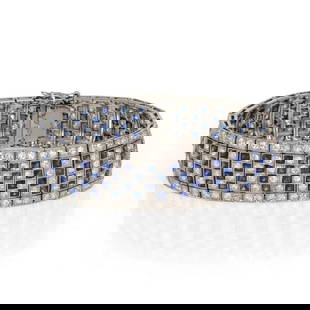 Art Deco Platinum Bracelet with 7ct Diamonds and 8ct French Cut Sapphires: Art Deco Platinum Bracelet with 7ct Diamonds and 8ct French Cut Sapphires This stunning Art Deco bracelet is exquisitely crafted from platinum and features a striking design adorned with 2.20 carats o