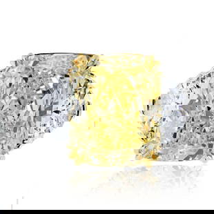 13.89 Carat Fancy Yellow Cushion Cut Diamond Ring in Platinum & 18K Yellow Gold: 13.89 Carat Fancy Yellow Cushion Cut Diamond Ring in Platinum & 18K Yellow Gold This exquisite ring features a stunning 13.89 carat cushion cut diamond in a captivating fancy yellow hue. The diamond i