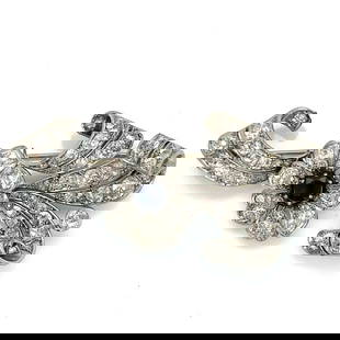 Art Deco Vintage Platinum Brooch with 1.00 Ct Sapphire and 72 Diamonds: Art Deco Vintage Platinum Brooch with 1.00 Ct Sapphire and 72 Diamonds This stunning Art Deco brooch showcases a luxurious combination of sapphires and diamonds set in platinum. The centerpiece featur