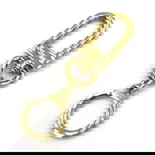Louis Vuitton Anocre Gold Metal Keyring Bag Charm for Men and Women: Louis Vuitton Anocre Gold Metal Keyring Bag Charm for Men and Women Elevate your accessory collection with this Louis Vuitton Anocre Keychain. Crafted from high-quality metal, this versatile keyring i
