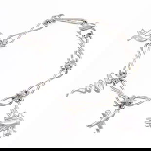 Tiffany Paloma Picasso Sterling Silver Charm Bracelet with 4 Unique Charms: Tiffany Paloma Picasso Sterling Silver Charm Bracelet with 4 Unique Charms This exquisite Tiffany charm bracelet features a design by Paloma Picasso, adorned with four unique charms: a dove, a kiss, a
