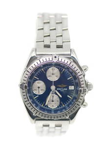 Breitling Chronomat A13047 Stainless Steel Watch with Box and Papers: Breitling Chronomat A13047 Stainless Steel Watch with Box and Papers This Breitling Chronomat wristwatch features a striking blue dial and is crafted from durable stainless steel. With a reliable mech
