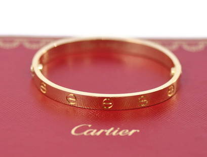 Cartier 18K Yellow Gold Love Bangle Bracelet Size 16 with Receipt: Cartier 18K Yellow Gold Love Bangle Bracelet Size 16 with Receipt Elevate your style with this exquisite Cartier 18K Yellow Gold Love Bracelet, size 16. This iconic bangle features a timeless design t